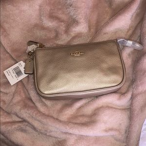 Gold coach bag